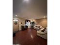 Living room with light beige walls and leather couches at 3630 N 86Th Ave, Phoenix, AZ 85037