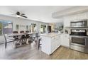 Kitchen with an island, stainless steel appliances, and white cabinets at 6124 N Florence Ave, Litchfield Park, AZ 85340