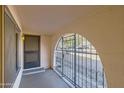 Gated entryway with a security door and arched metal gate at 4716 S Taylor Dr, Tempe, AZ 85282