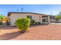 House with covered parking and desert landscaping at 723 S Pima St, Mesa, AZ 85210