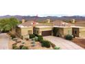 Aerial view of a home with a tile roof, attached garage, and desert landscaping at 18714 E Amarado Cir, Rio Verde, AZ 85263