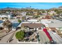 Elevated perspective of a cozy home with a landscaped front yard and attached carport at 4140 E Turney Ave, Phoenix, AZ 85018