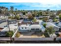 Aerial view of the backyard, featuring a covered patio and surrounding neighborhood homes at 4140 E Turney Ave, Phoenix, AZ 85018