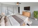 Spacious main bedroom with large TV and ample closet space at 1433 N 53Rd Ave, Phoenix, AZ 85043