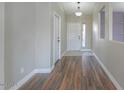 A hallway with wood flooring and neutral color scheme at 19776 N Harris N Dr, Maricopa, AZ 85138