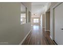 Bright hallway with hardwood floors and views into other rooms at 19776 N Harris N Dr, Maricopa, AZ 85138