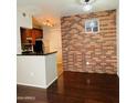 Kitchen with dark wood cabinets, black granite counters, and stainless steel appliances at 3302 N 7Th St # 226, Phoenix, AZ 85014