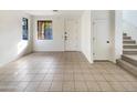 Empty living room with tiled floor, ready for furniture and personal touches at 3636 E Stampede Dr, Gilbert, AZ 85297