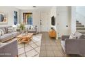 Living room with comfortable seating, stylish rug, and modern decor at 3636 E Stampede Dr, Gilbert, AZ 85297