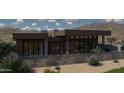 Back view of a modern house with large windows, desert plants, and a fence at 37200 N Cave Creek Rd # 1011, Scottsdale, AZ 85262