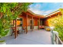 Covered front porch with wood beams and seating area at 5920 N 10Th Ave, Phoenix, AZ 85013