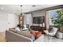 Living room featuring a modern design, wood floors, and ample natural light at 5807 E Rose Garden Ln, Phoenix, AZ 85054