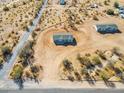 An aerial view showcasing the home's location and the surrounding desert landscape at 51937 W Wildwood Rd, Maricopa, AZ 85139