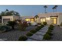 Modern home with attractive landscaping and a walkway leading to the entrance at 9919 N 47Th Pl, Phoenix, AZ 85028