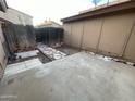 Backyard with a paved area and a wooden fence at 12445 N 21St Ave # 31, Phoenix, AZ 85029
