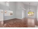 Open dining area with wood floors and large windows at 13635 N 103Rd Way, Scottsdale, AZ 85260