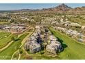 Aerial view of community near mountains, showcasing upscale homes and golf course at 2 E Biltmore Estates Dr # 115, Phoenix, AZ 85016