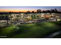Luxury community at sunset, featuring attractive architecture and lush landscaping at 2 E Biltmore Estates Dr # 115, Phoenix, AZ 85016