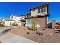 Modern two-story home with desert landscaping and a paved driveway at 20939 S 225Th Way, Queen Creek, AZ 85142