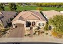 Stunning curb appeal with desert landscaping and a welcoming entryway at 36011 N Stoneware Dr, Queen Creek, AZ 85140