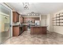 Modern kitchen featuring stainless steel appliances, granite countertops, and an island at 4252 E Oakland St, Gilbert, AZ 85295