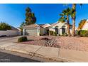 Attractive single-story residence featuring a tile roof, attached two-car garage, and desert-friendly landscaping at 4326 E Stanford Ave, Gilbert, AZ 85234