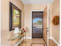 Elegant entryway with decorative console table and artwork at 10209 W Mustang Dr, Casa Grande, AZ 85194