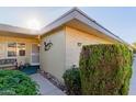 Charming front yard with lush greenery and a cozy porch area at 14015 N 111Th Ave, Sun City, AZ 85351