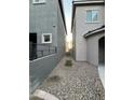 Side yard with a gravel path and AC unit at 1737 W Pollack St, Phoenix, AZ 85041