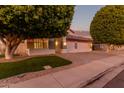 Inviting two-story home with landscaping, mature trees, and a three-car garage at 2280 E Stephens Pl, Chandler, AZ 85225