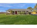 House exterior with red door and landscaping at 23504 S 156Th St, Gilbert, AZ 85298