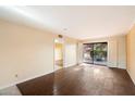 Living area with sliding glass doors, wood-look flooring, and neutral walls at 4303 E Cactus Rd # 146B, Phoenix, AZ 85032