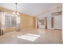 Bright dining room with tile floors and a chandelier at 131 N Del Pueblo Pl, Chandler, AZ 85226