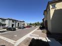 Community with parking lot and several houses with similar design at 1741 W Pollack St, Phoenix, AZ 85041