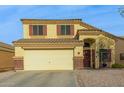 Two-story house with a large driveway and desert landscaping at 24018 W Wayland Dr, Buckeye, AZ 85326