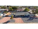 Newly renovated mid-century modern home with a large front yard at 6528 E Bambi Dr, Mesa, AZ 85215