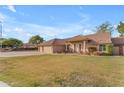 House exterior boasts a well-manicured lawn and two car garage at 942 N Miramar --, Mesa, AZ 85213