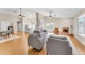 Open living room with hardwood floors and kitchen views at 942 N Miramar --, Mesa, AZ 85213