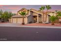 Two-story house with a two car garage and desert landscaping at 20619 N 16Th Way, Phoenix, AZ 85024