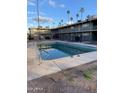 Community pool with surrounding apartments visible at 2150 W Missouri Ave # 121, Phoenix, AZ 85015