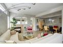 Open living room with sectional sofa, fireplace, and dining area at 14430 N Agave Dr, Fountain Hills, AZ 85268