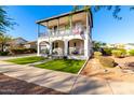 Two-story house with balcony, porch, and landscaped yard at 20606 W Lost Creek Dr, Buckeye, AZ 85396