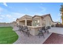 Backyard patio features a built-in bar with seating at 21559 E Russet Rd, Queen Creek, AZ 85142