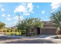 Front view of a charming house with a landscaped yard at 4049 E Roy Rogers Rd, Cave Creek, AZ 85331