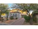 House exterior featuring a two-car garage and landscaping at 18379 N 95Th St, Scottsdale, AZ 85255