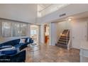 Spacious living room with high ceilings and tile floors at 10051 E Carmel Ave, Mesa, AZ 85208