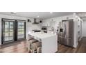 Updated kitchen with white cabinets, stainless steel appliances, and an island at 13050 N 17Th Ave, Phoenix, AZ 85029