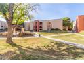 Exterior view of an apartment building with landscaping and walkways at 1340 N Recker Rd # 214, Mesa, AZ 85205