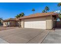 View of the front of the house, showcasing the garage and driveway at 1716 N Temple St, Mesa, AZ 85203