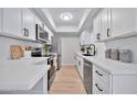 Modern kitchen with white cabinets, stainless steel appliances, and quartz countertops at 4141 N 31St St # 414, Phoenix, AZ 85016